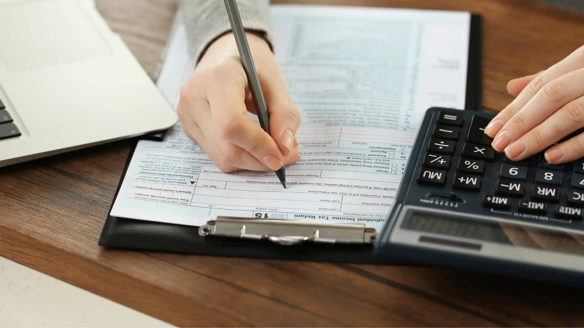 Statutory returns filing service provider at desk preparing documents